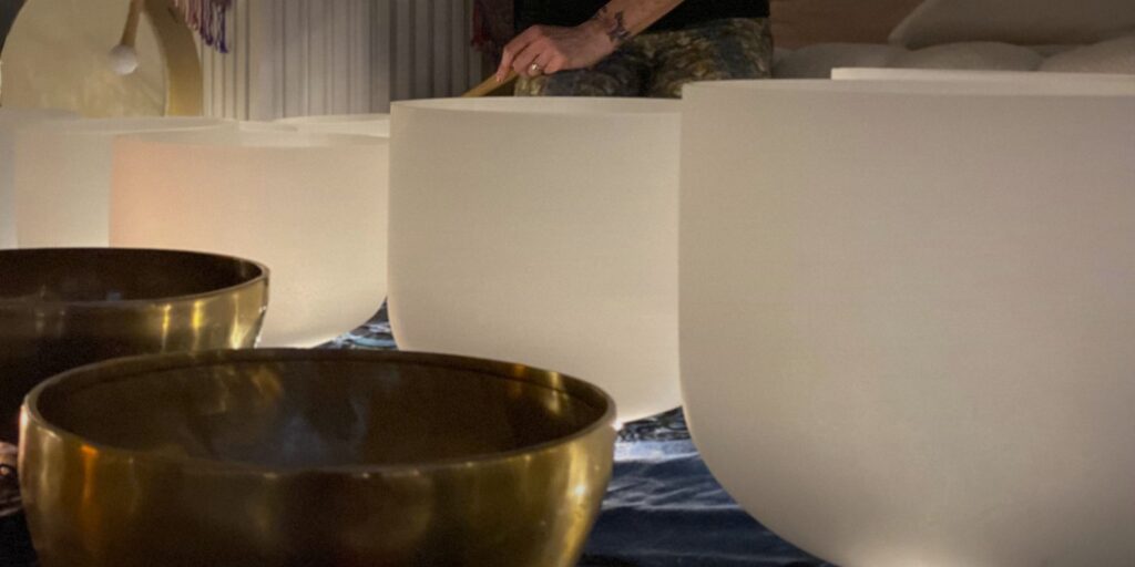 Close up of crystal singing bowls and a Tibetan singing bowl